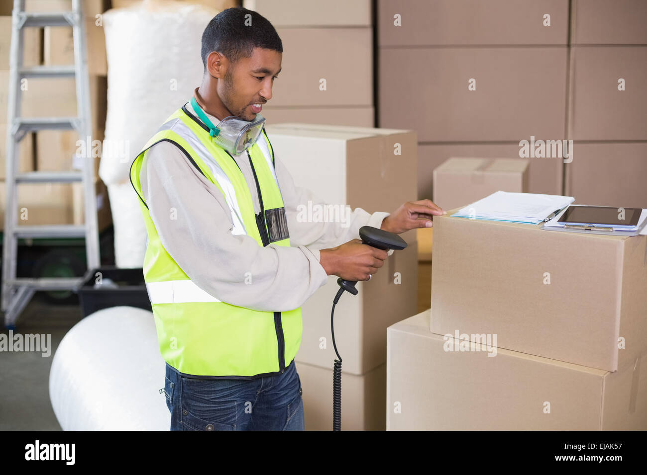 Warehouse worker scanning a box Stock Photo Alamy