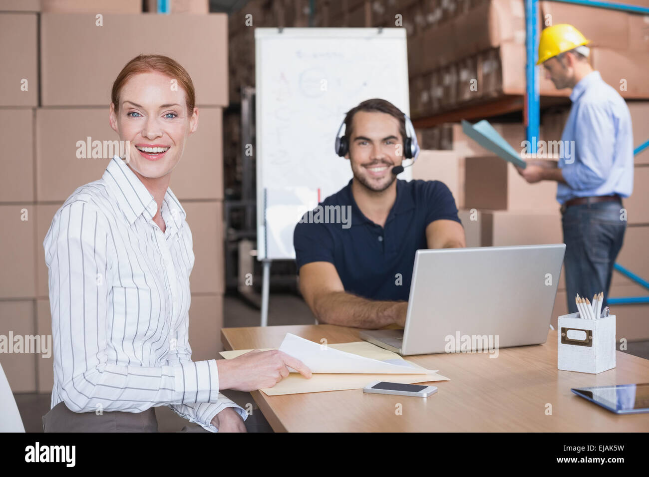 Warehouse team working together on shipment Stock Photo - Alamy