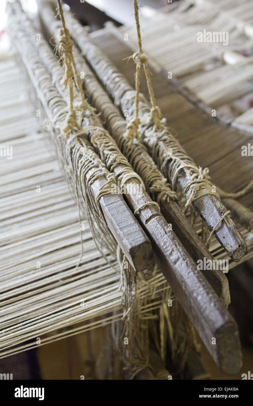 Weaver with wire to make looms, sewing and manufacturing Stock Photo