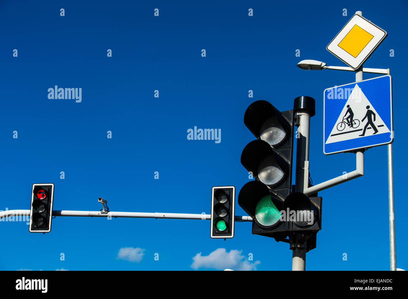 Traffic lights over blue sky Stock Photo