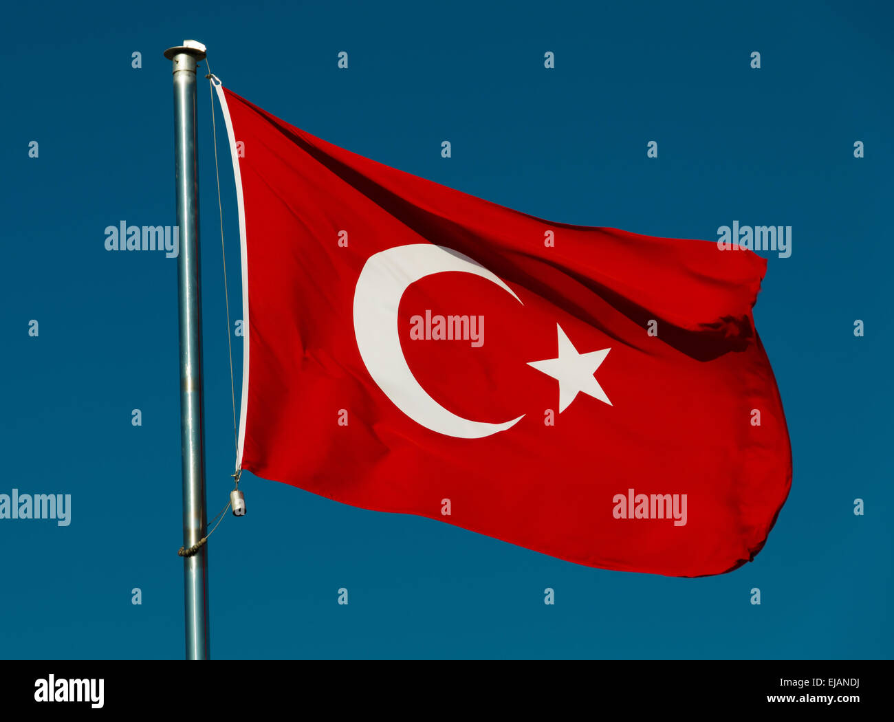 Turkish national flag over blue sky Stock Photo - Alamy