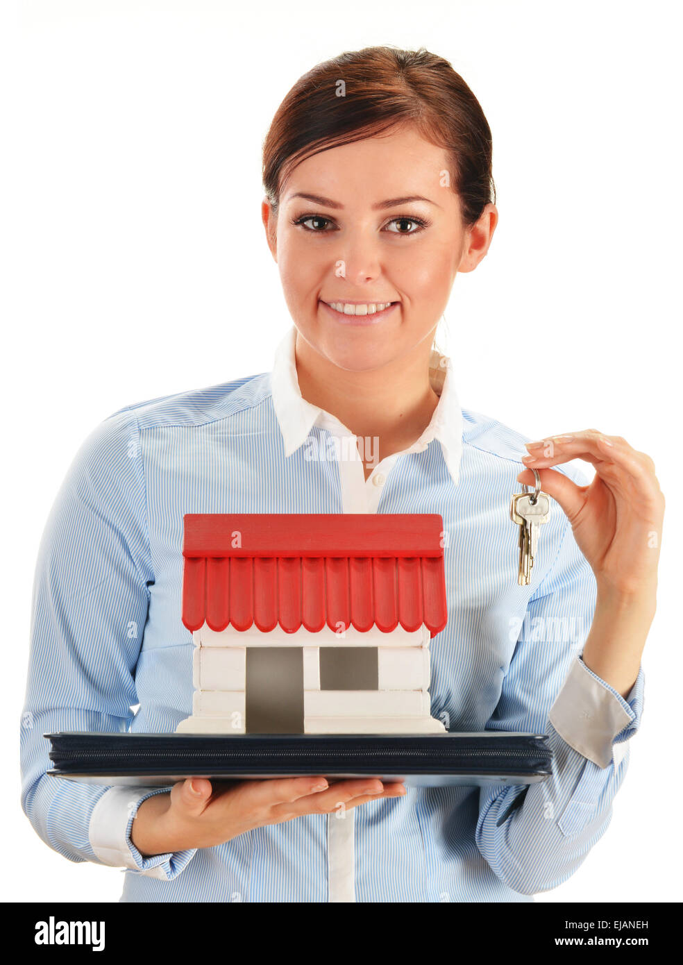 Young woman holding small house and keys Stock Photo - Alamy