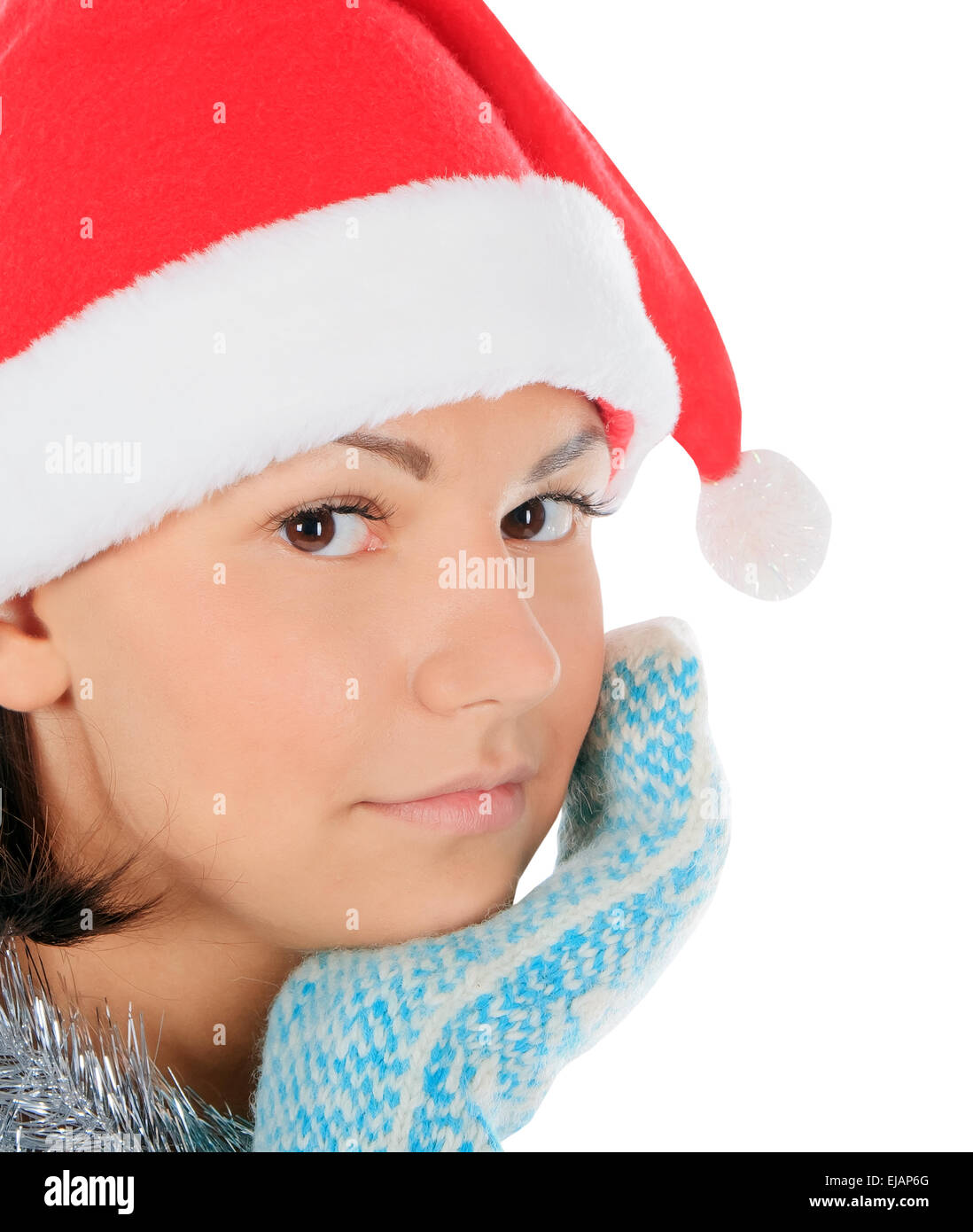 Yong female in santa hat over white Stock Photo