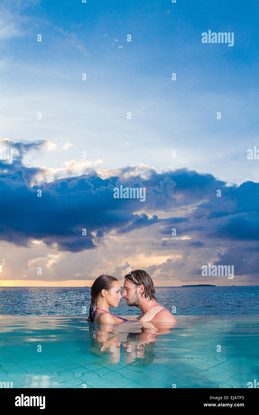 Young couple enjoying a romantic swim Stock Photo