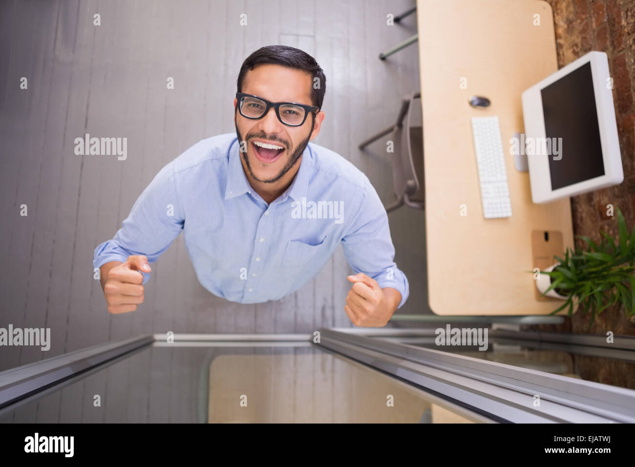 Cheerful businessman cheering in office Stock Photo - Alamy