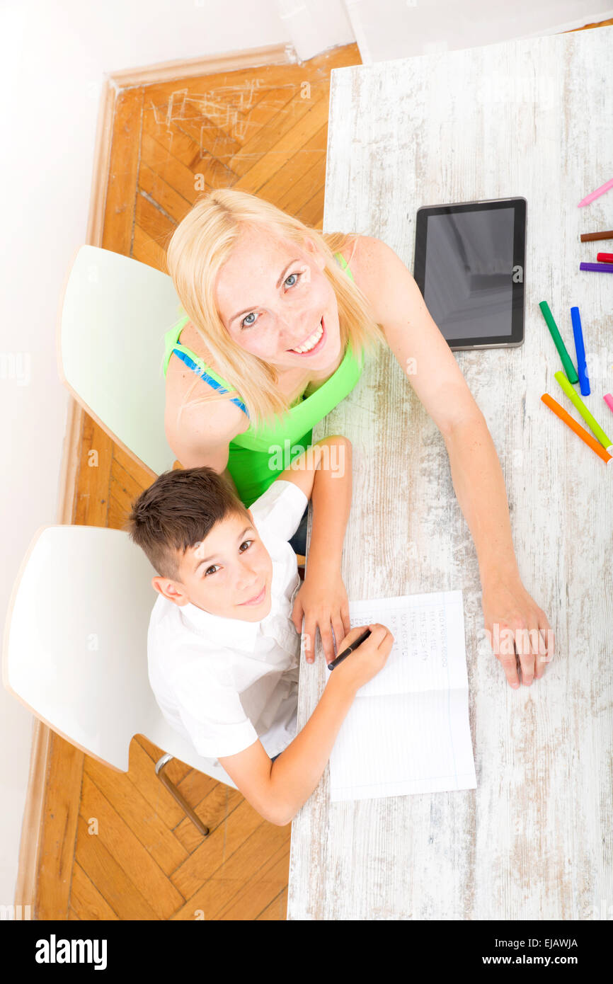 Mother and son doing homework Stock Photo - Alamy
