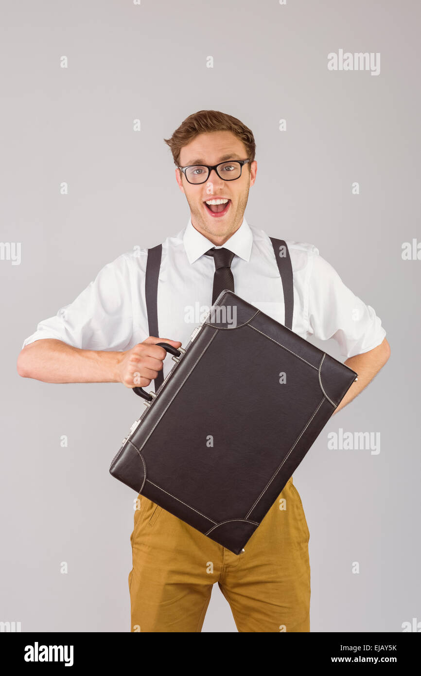 Geeky businessman holding his briefcase Stock Photo - Alamy