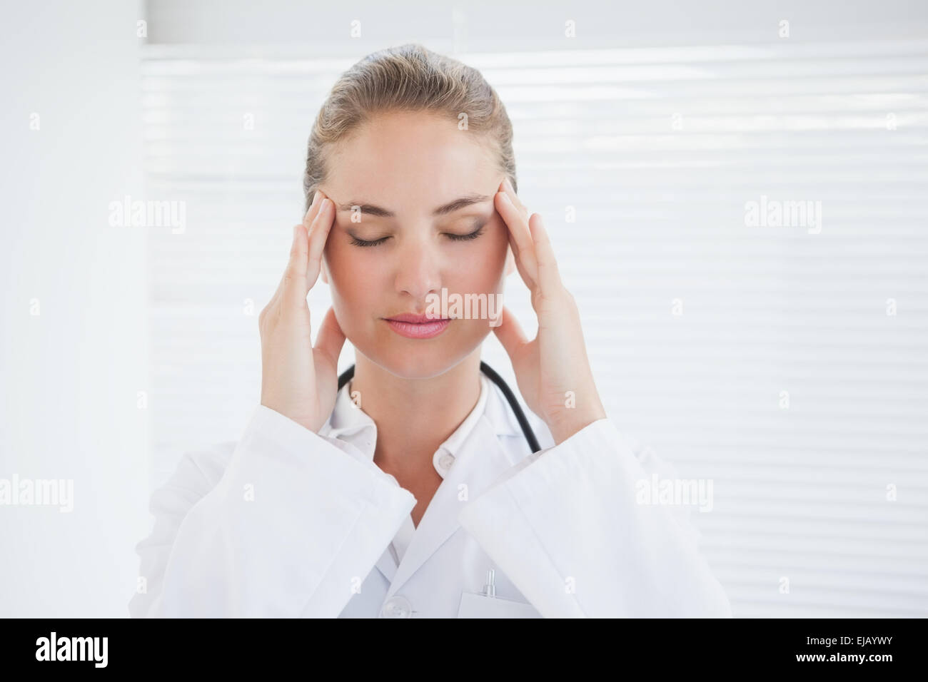 Doctor suffering from a migraine Stock Photo Alamy