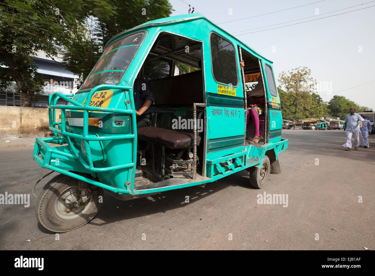 Three wheeler Tempo tricycle taxi bus in Lucknow city street, Uttar Pradesh, India Stock Photo