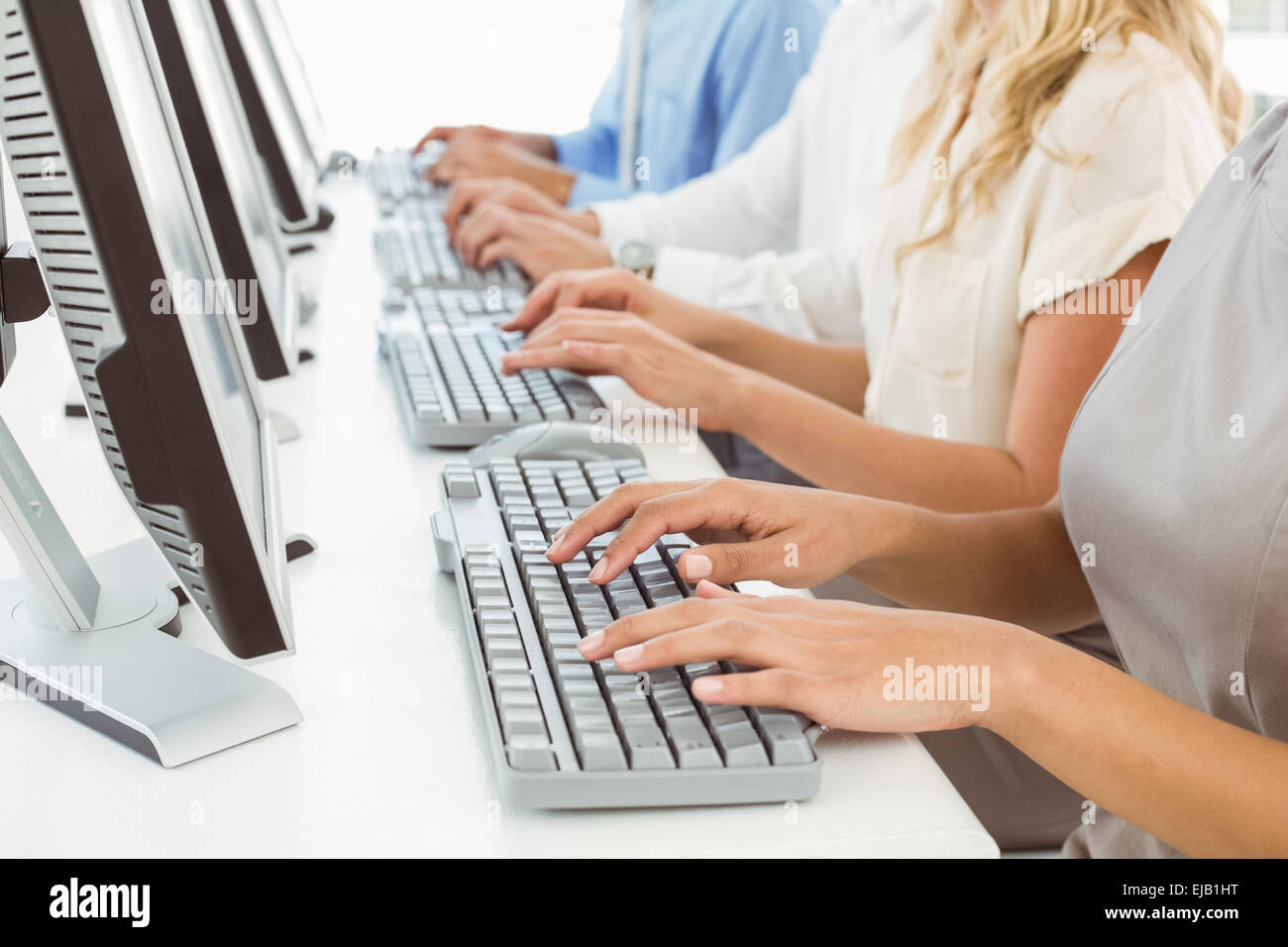 Business people using computers in office Stock Photo - Alamy