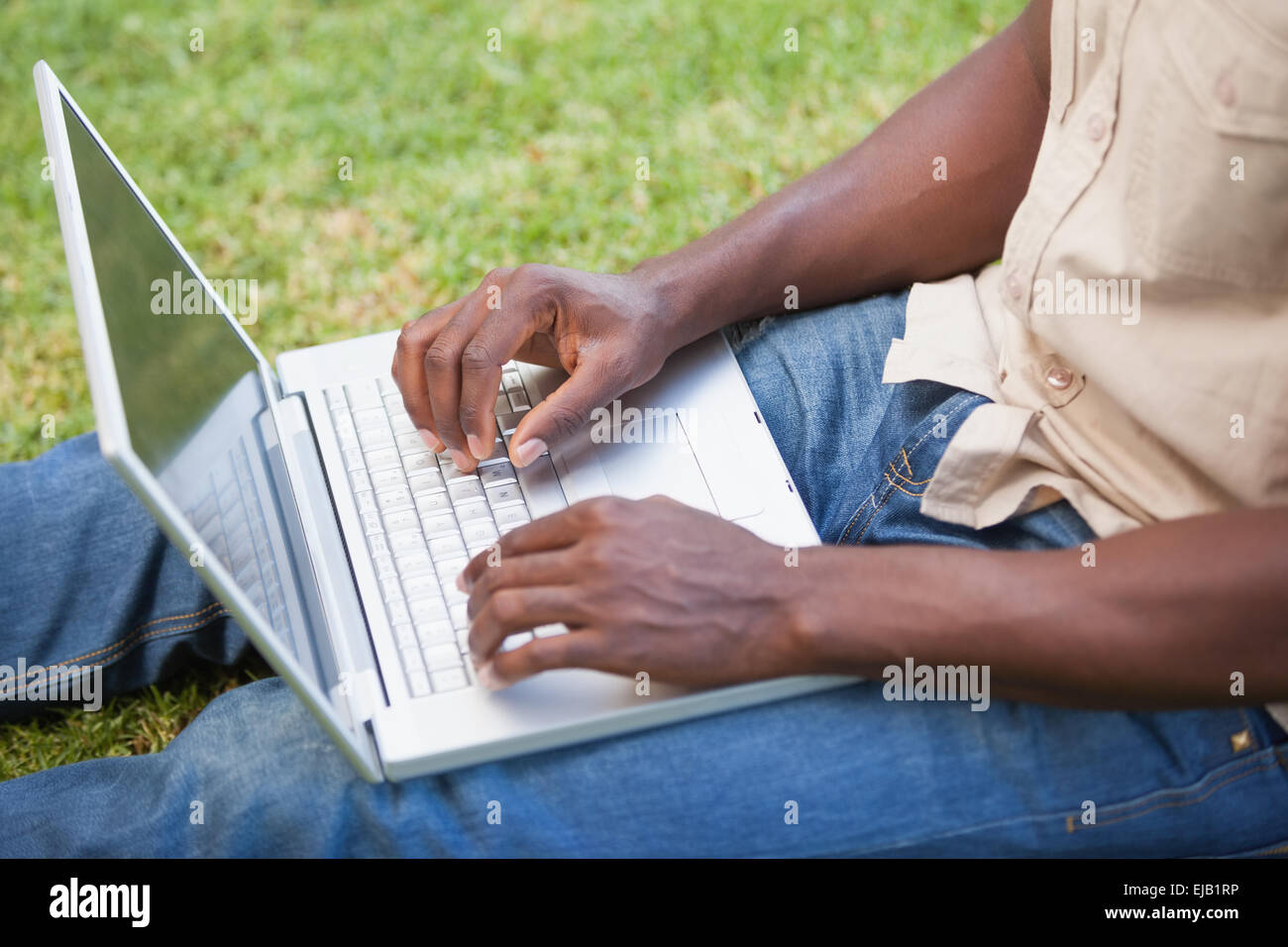 Man using computer in garden hi-res stock photography and images - Alamy