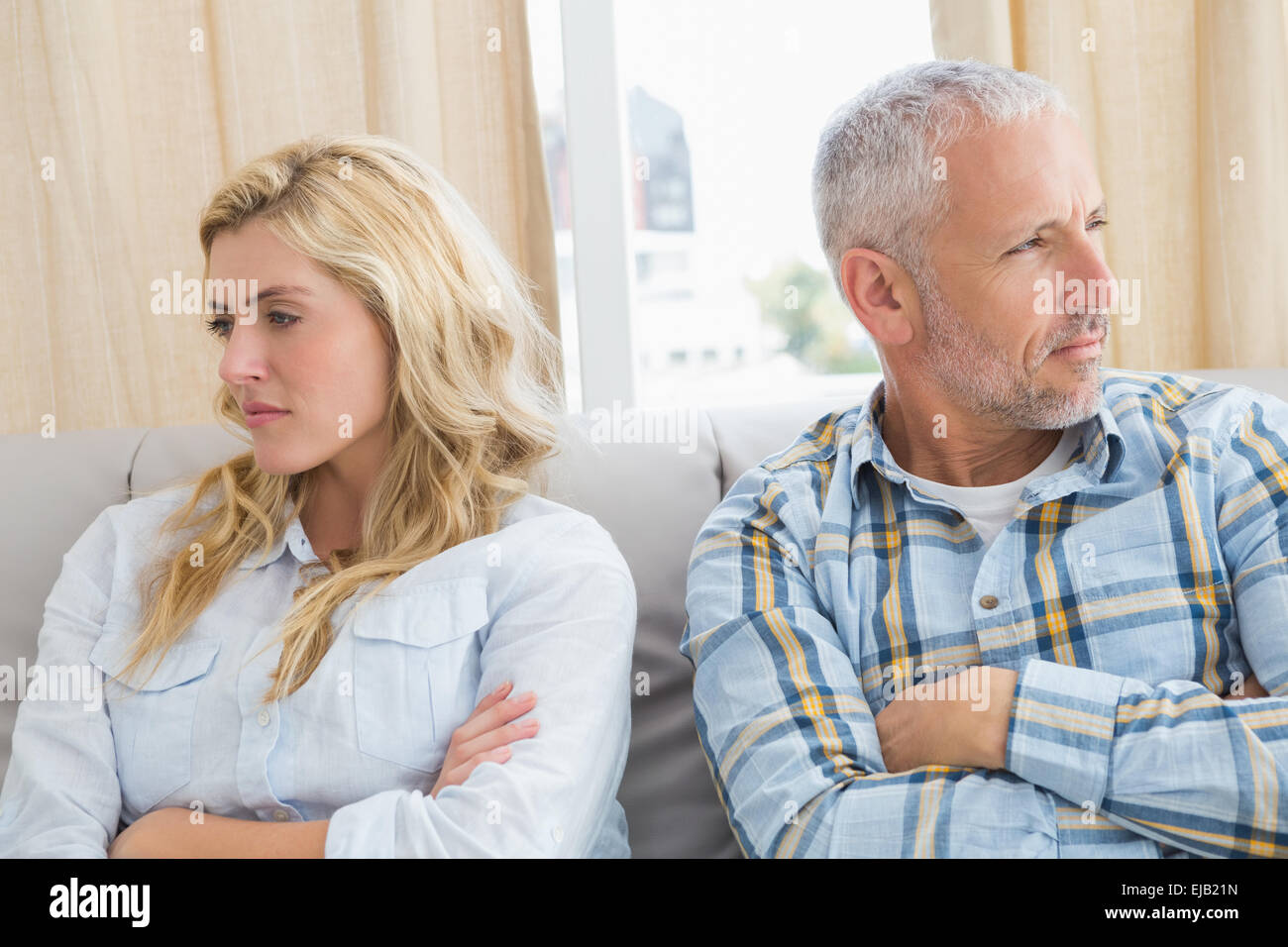 Couple arguing on the couch Stock Photo - Alamy