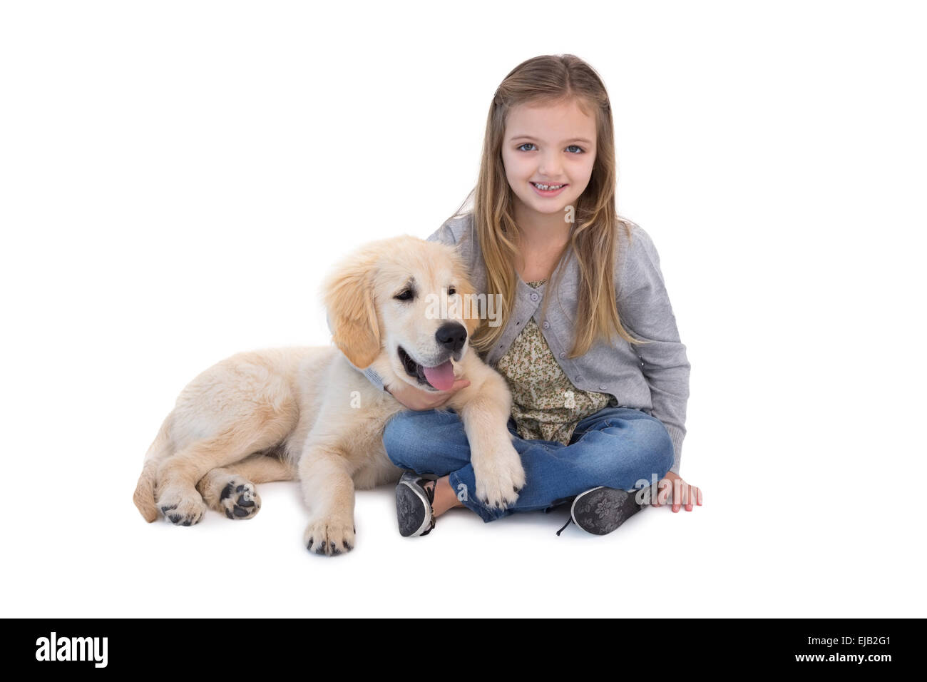 Cute little girl sitting with her dog Stock Photo - Alamy