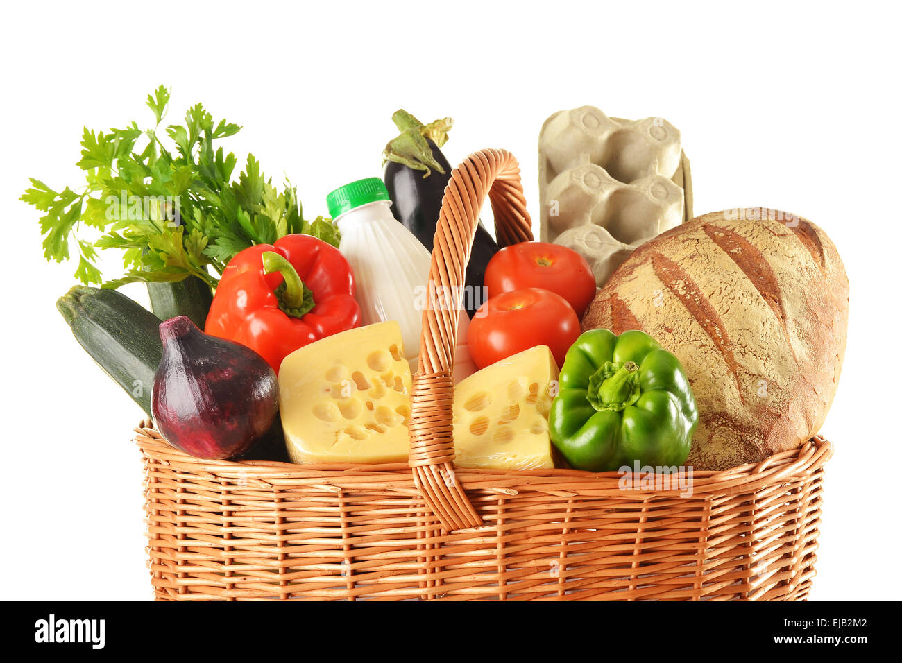 Groceries in wicker basket isolated on white Stock Photo Alamy