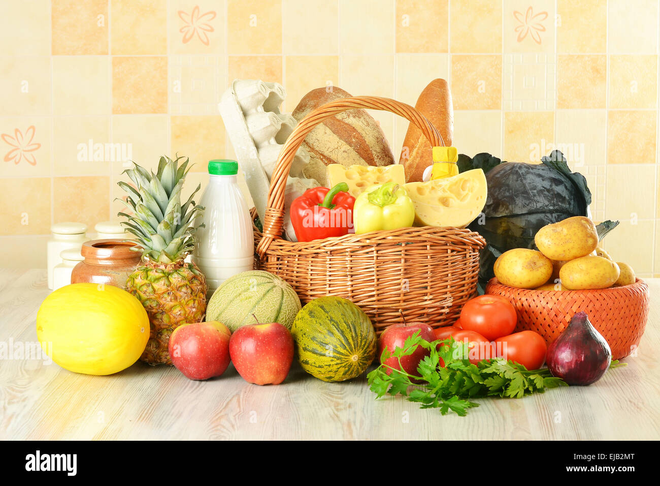 Groceries in wicker basket Stock Photo Alamy