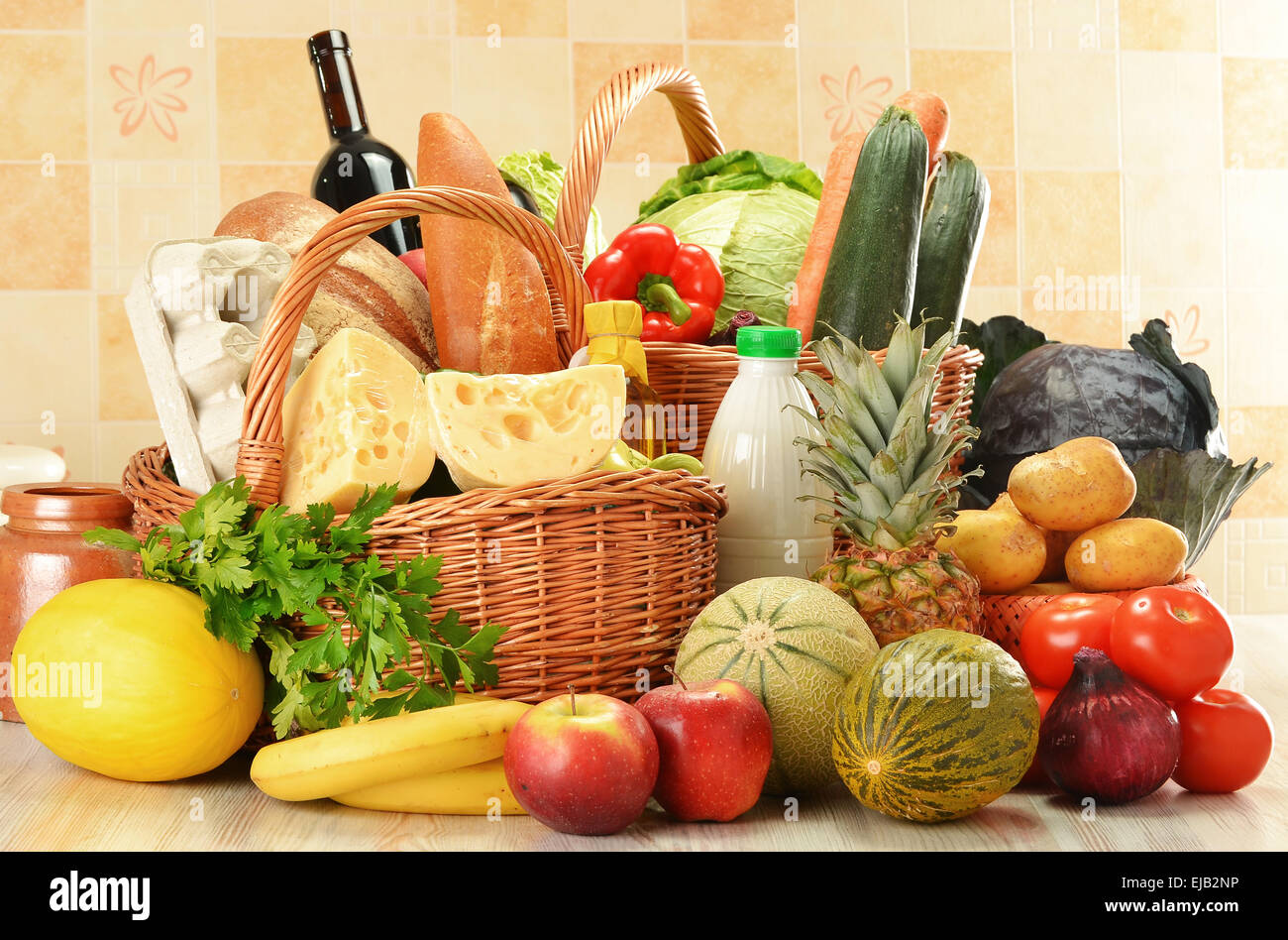 Groceries in wicker basket Stock Photo Alamy
