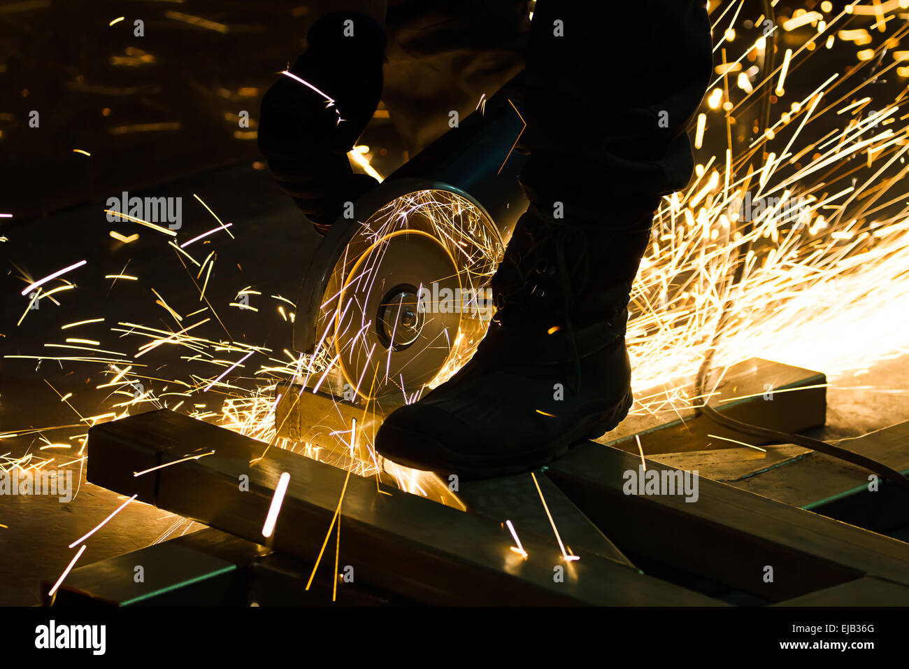 sharpening and cutting of iron by abrasive disk machine Stock Photo - Alamy