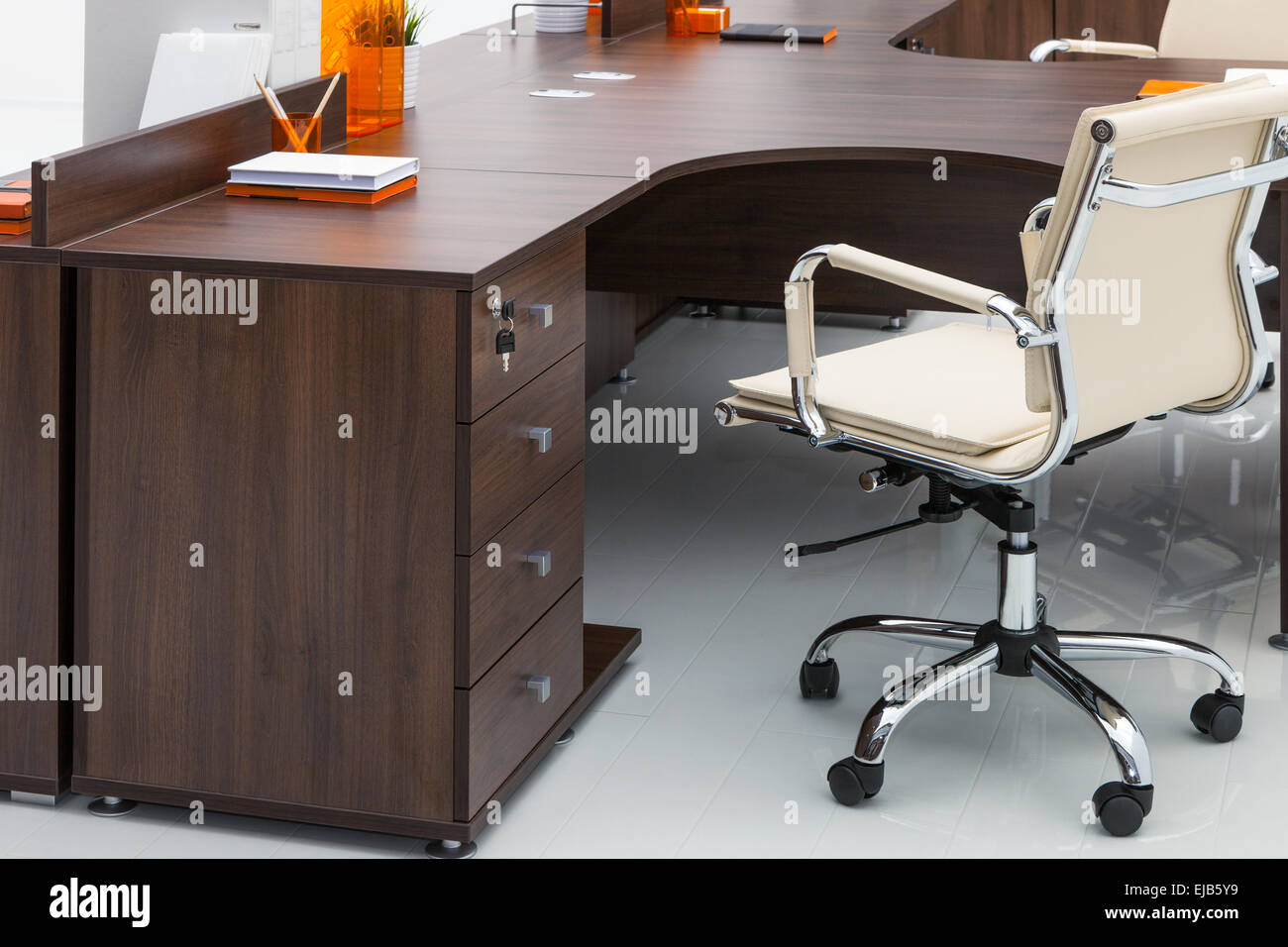 desks and white leather chairs Stock Photo Alamy