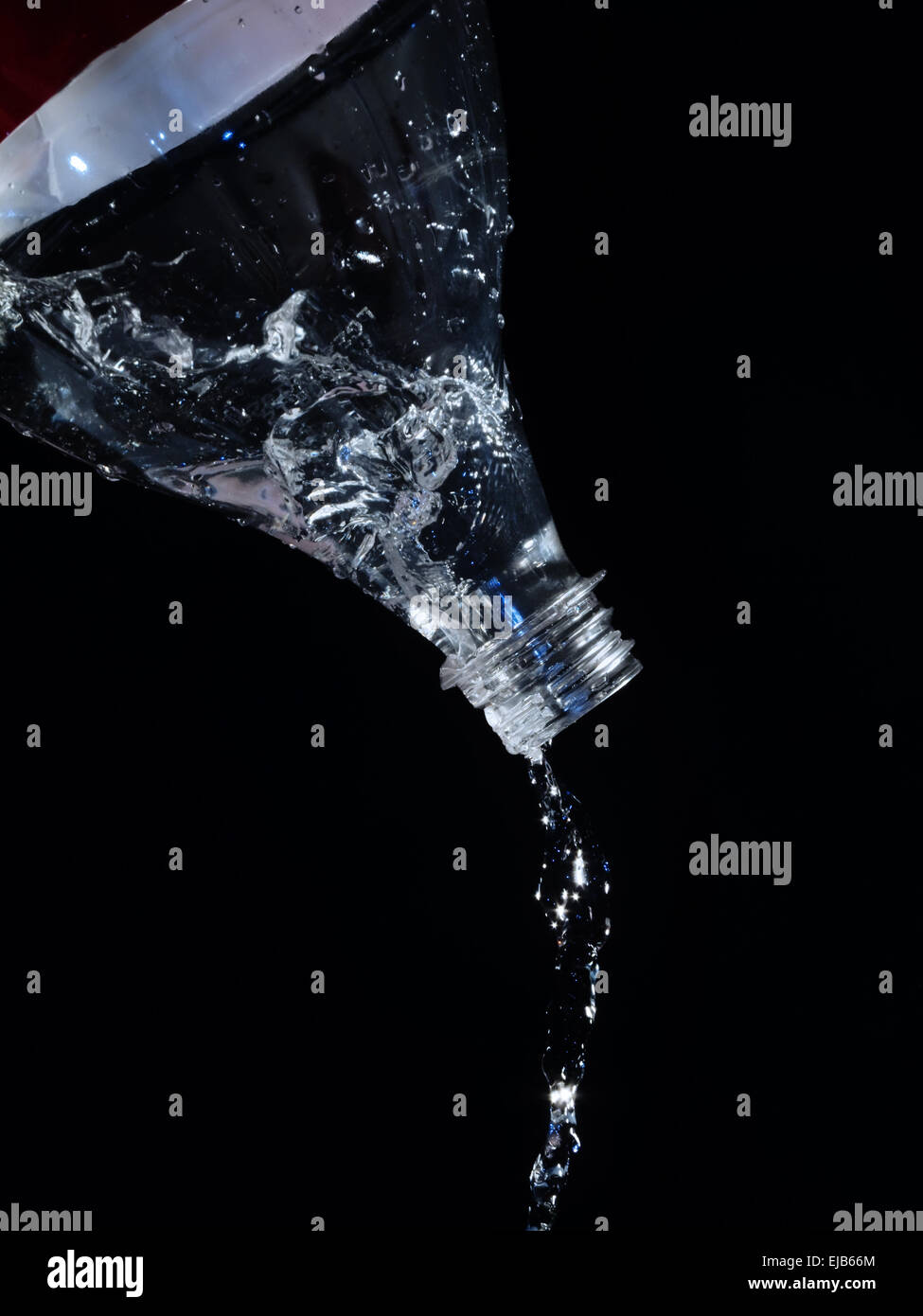 splash bottle on black Stock Photo
