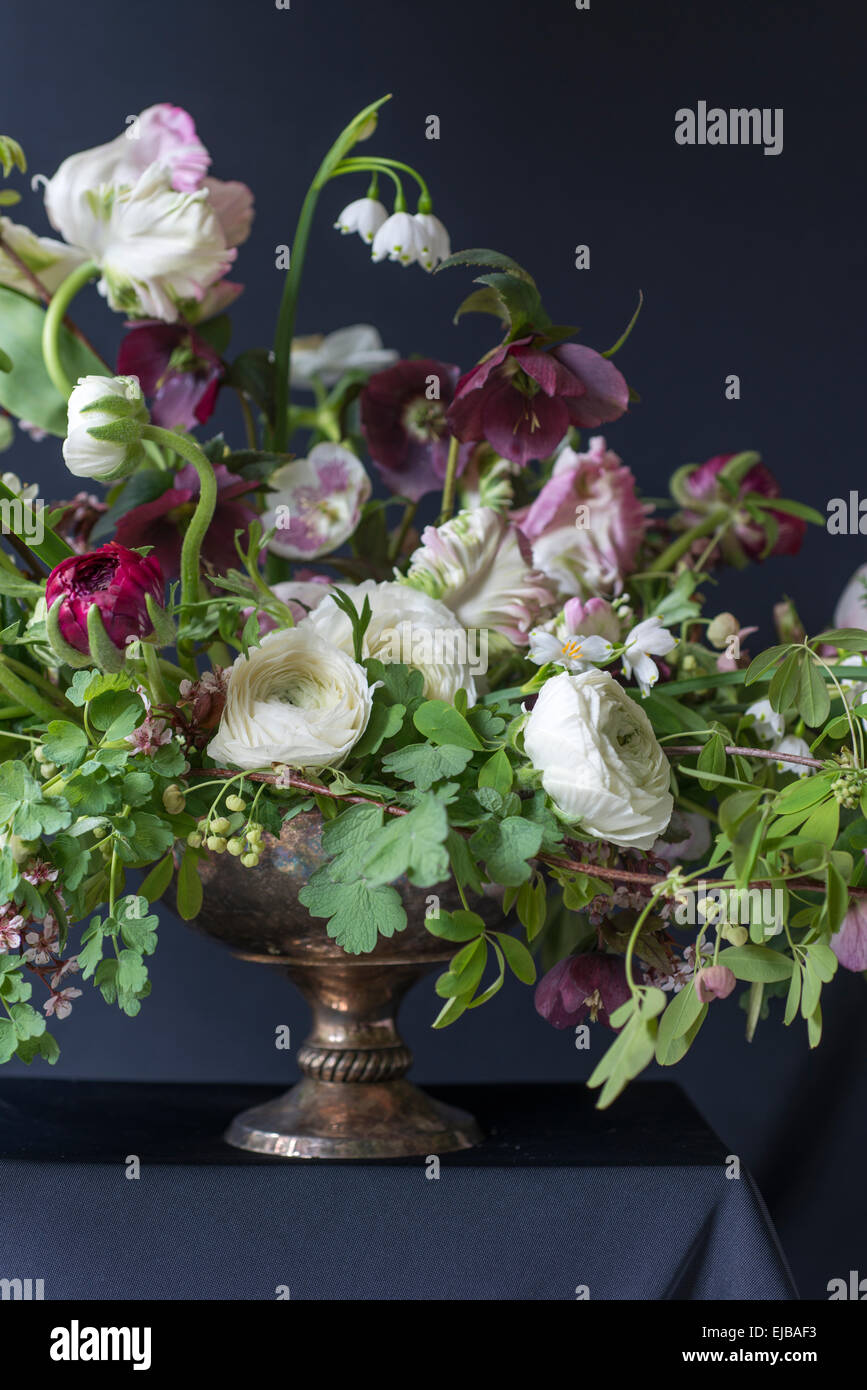 Spring bouquet of parrot tulips, ranunculus, anemones and Lucojum Stock Photo
