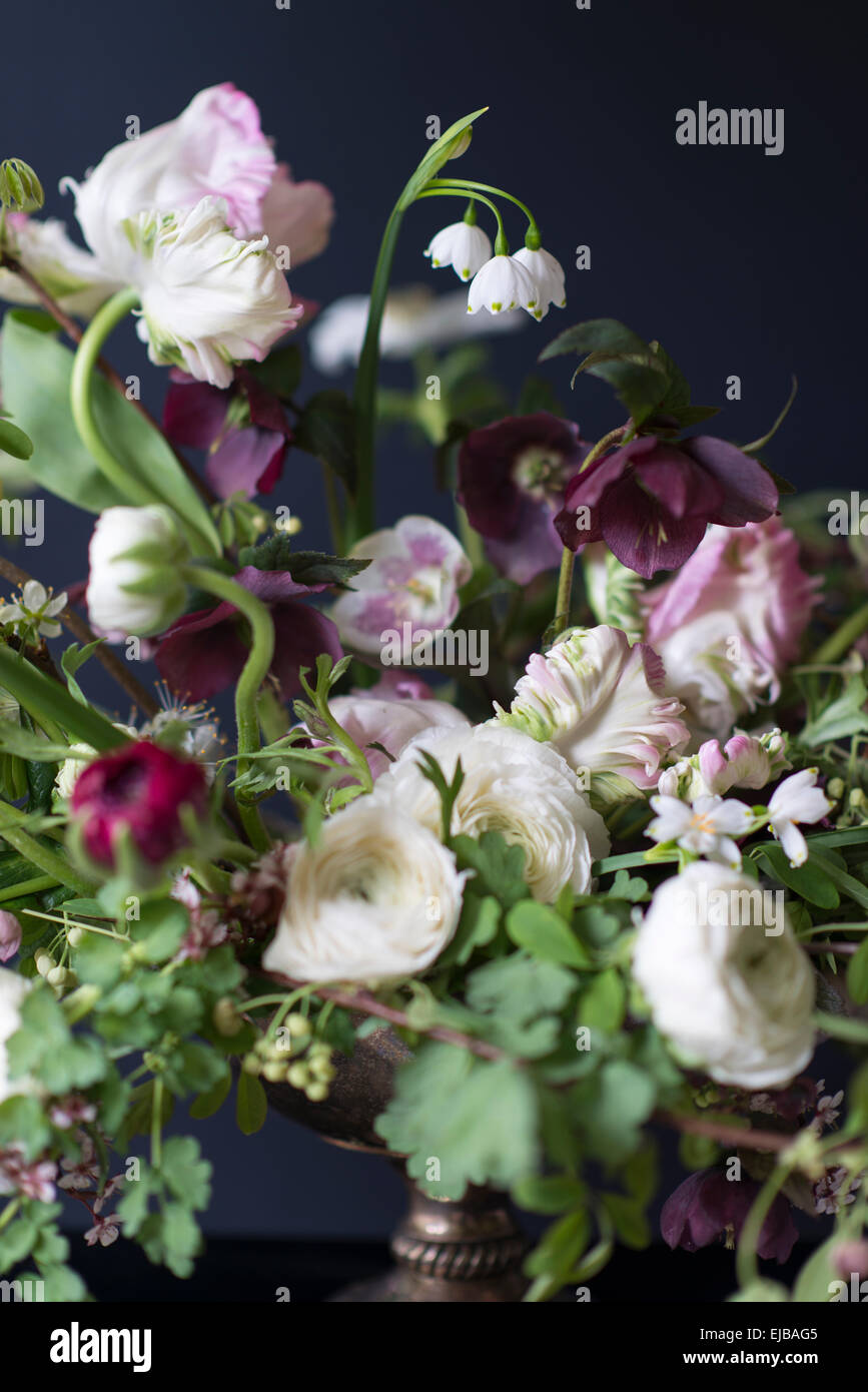 Spring bouquet of parrot tulips, ranunculus, anemones and Lucojum Stock Photo