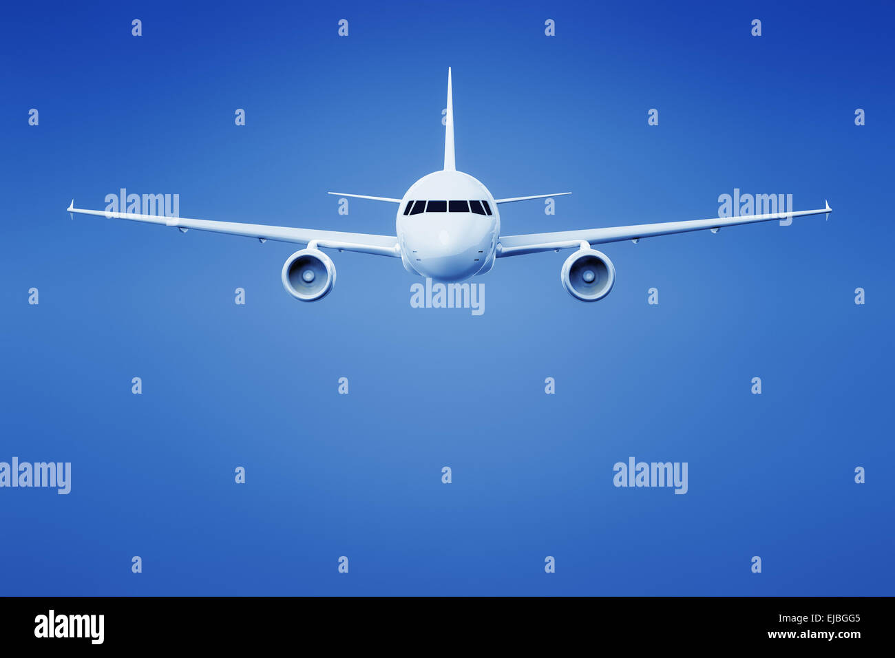 airplane in the bright blue sky Stock Photo