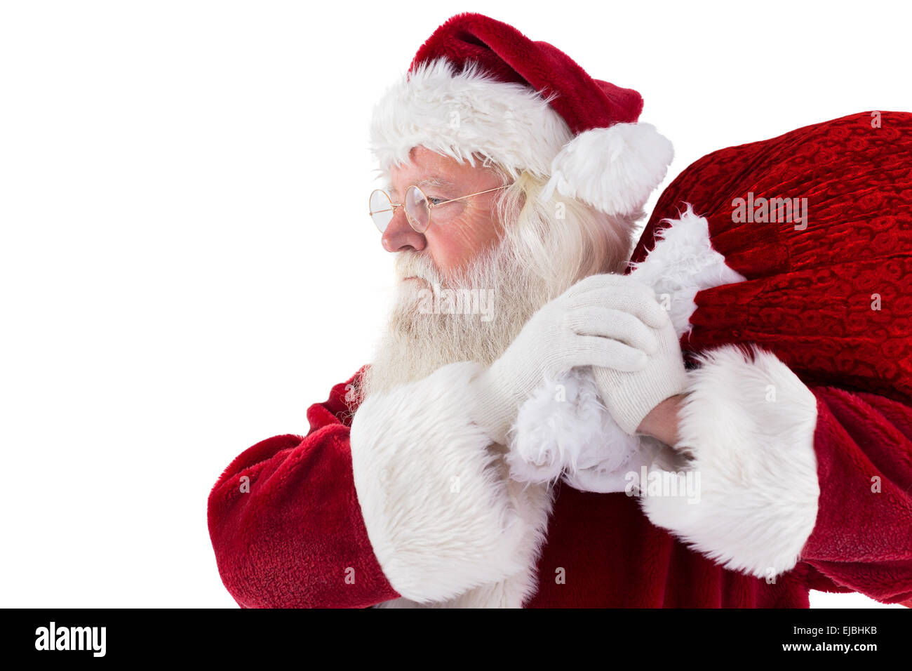 Santa carries his red bag Stock Photo - Alamy