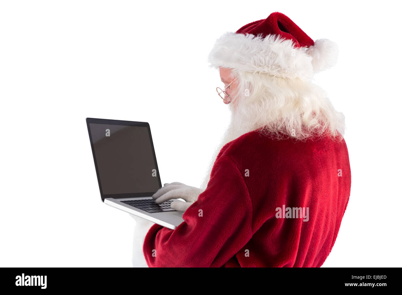 Santa Claus uses a laptop Stock Photo