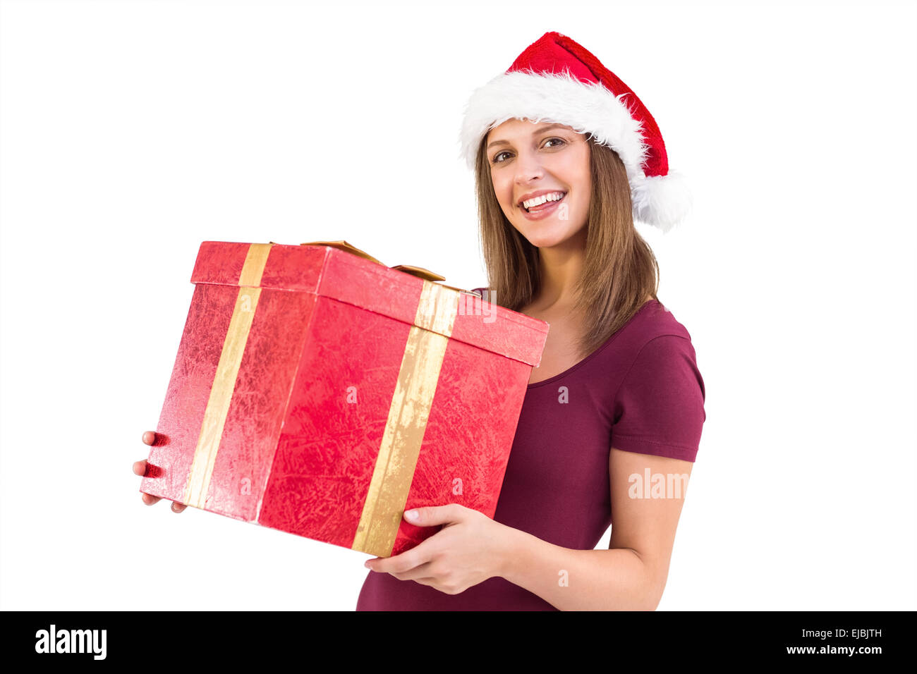 Young woman in santa hat holding gift box Stock Photo - Alamy