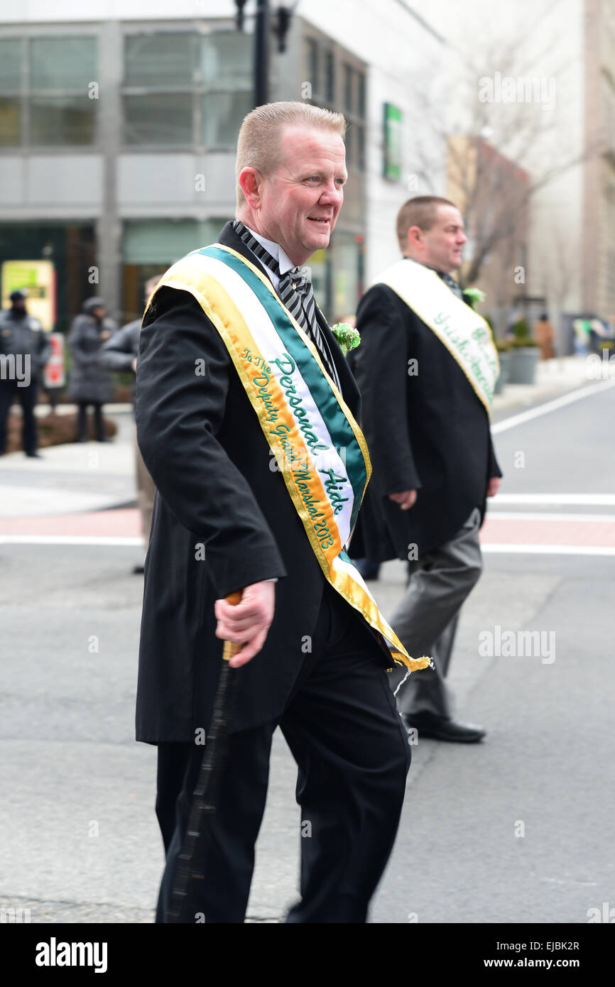 Persona Aid to the Grand Marshal parading during the 2013 St. Patrick's Day parade. Newark, New Jersey. USA Stock Photo