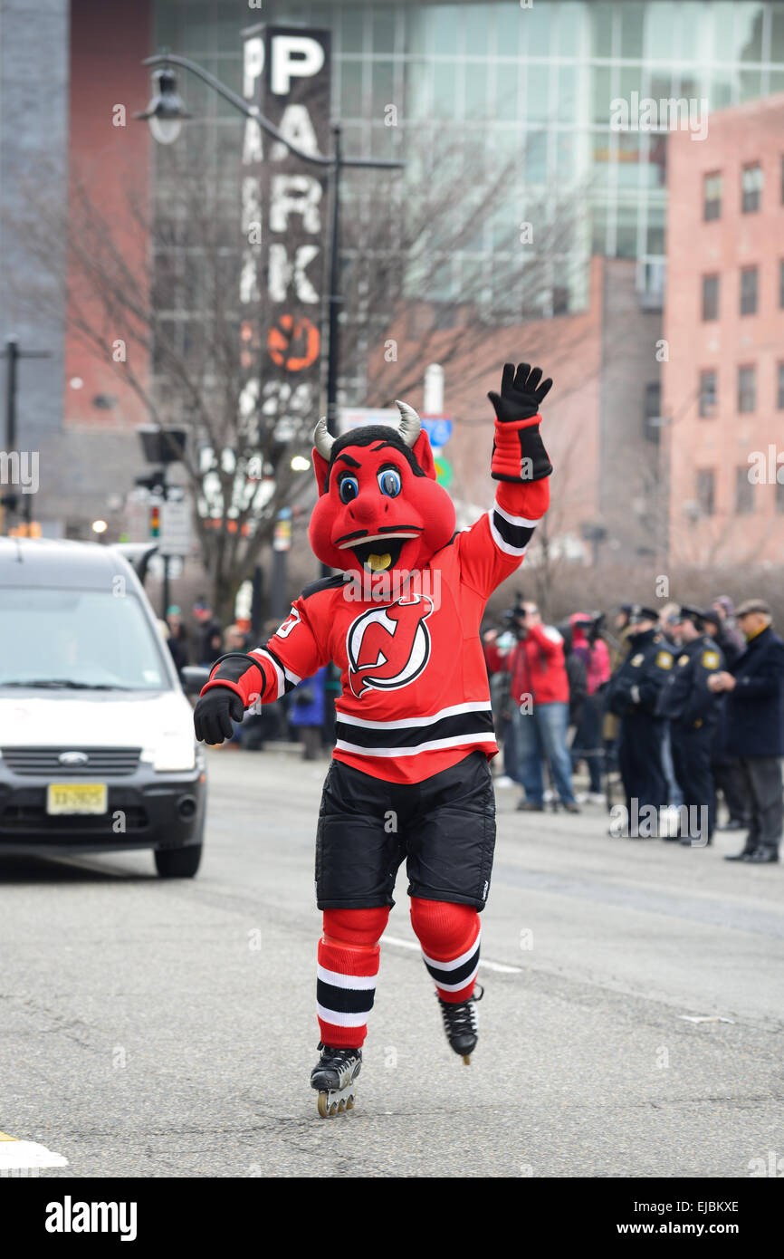 New Jersey Devil's hockey team mascot greeting fans during the 2013 St. Patrick's Day parade in Newark, New Jersey. USA. Stock Photo