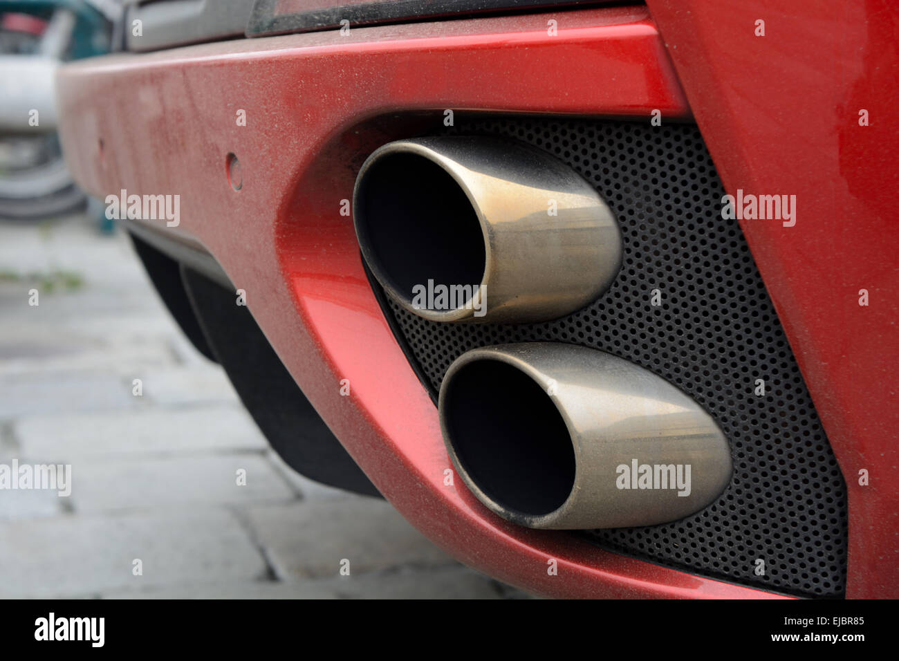 dual exhaust with a sporty car Stock Photo