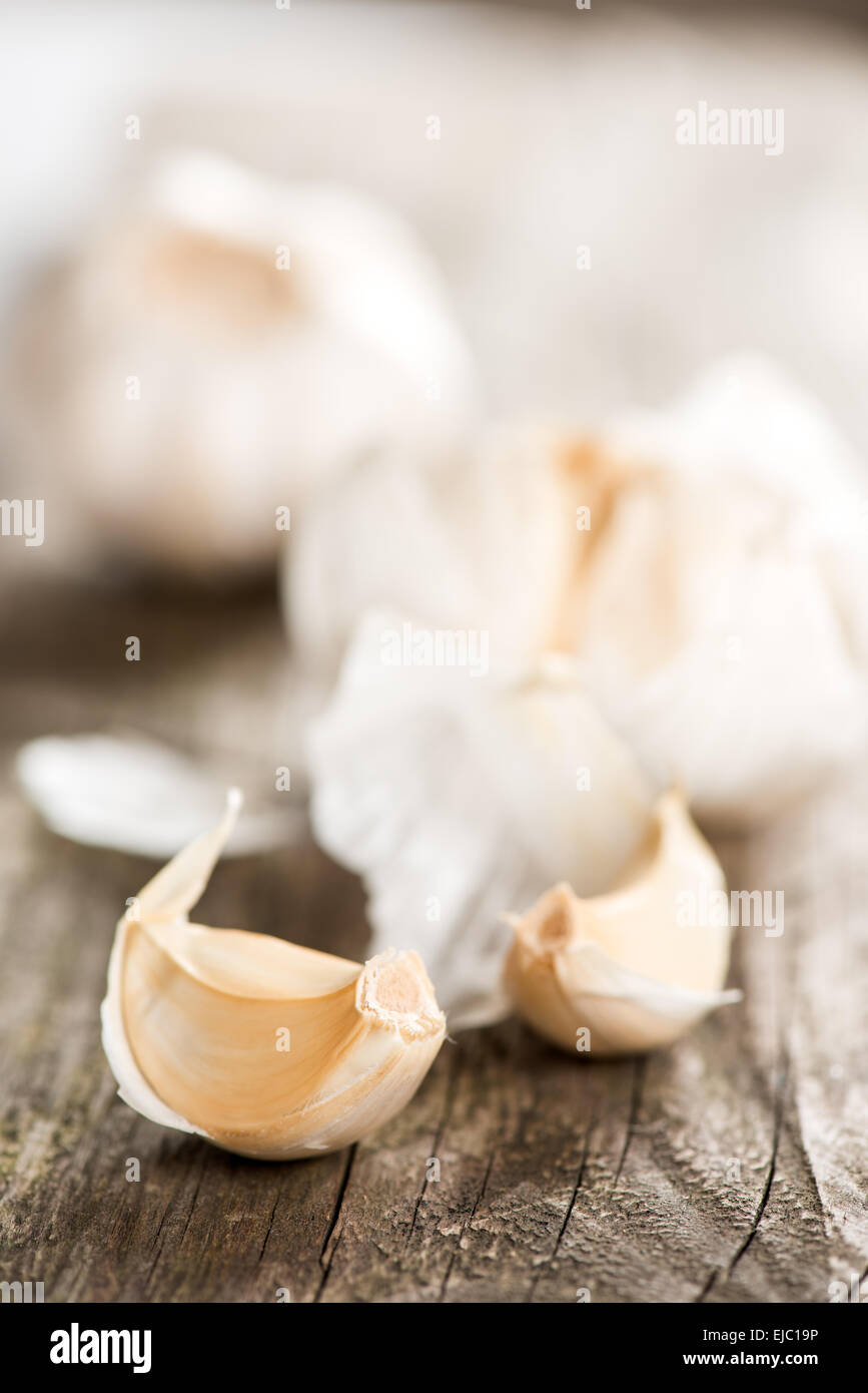 Garlic on wooden table close up copy space Stock Photo