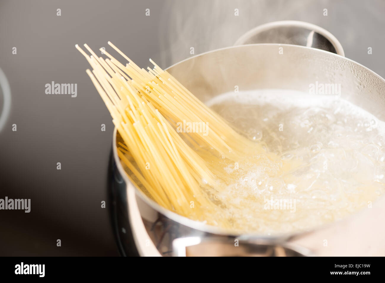 Pan with spaghetti cooking in boiling water Stock Photo