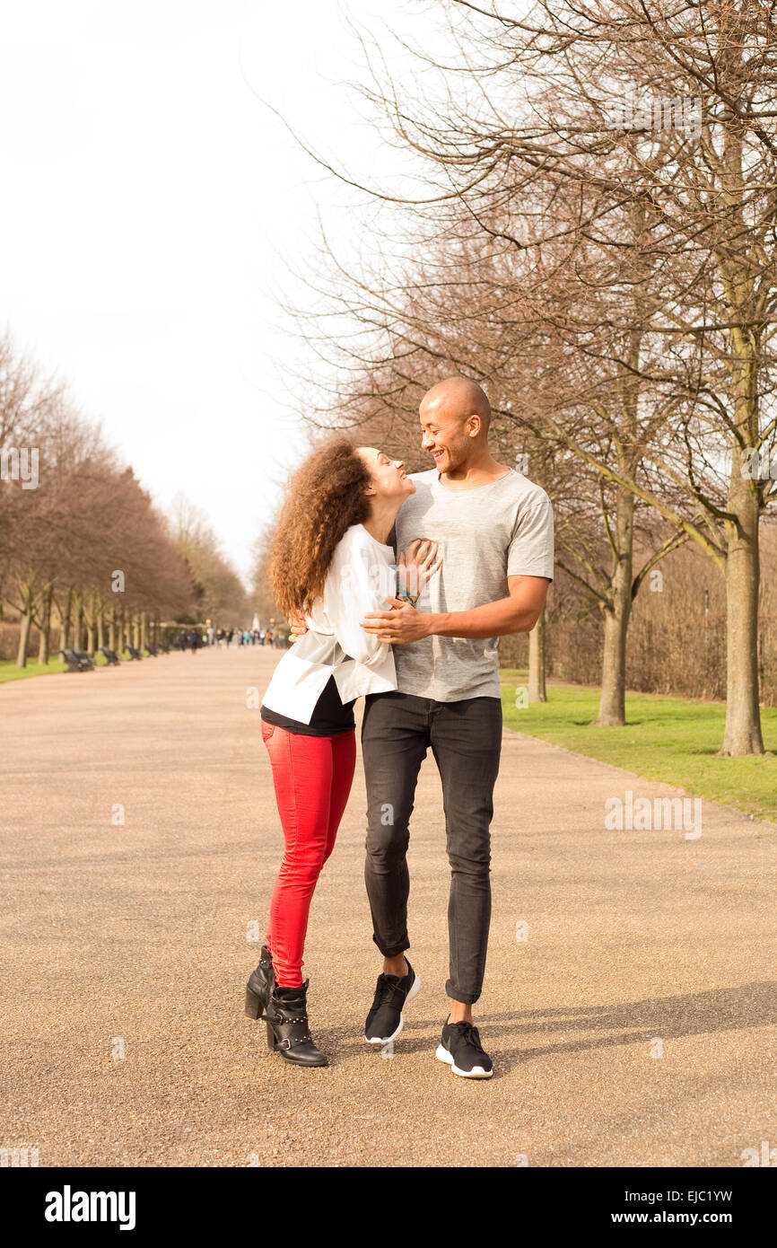 young couple walking in the park Stock Photo - Alamy