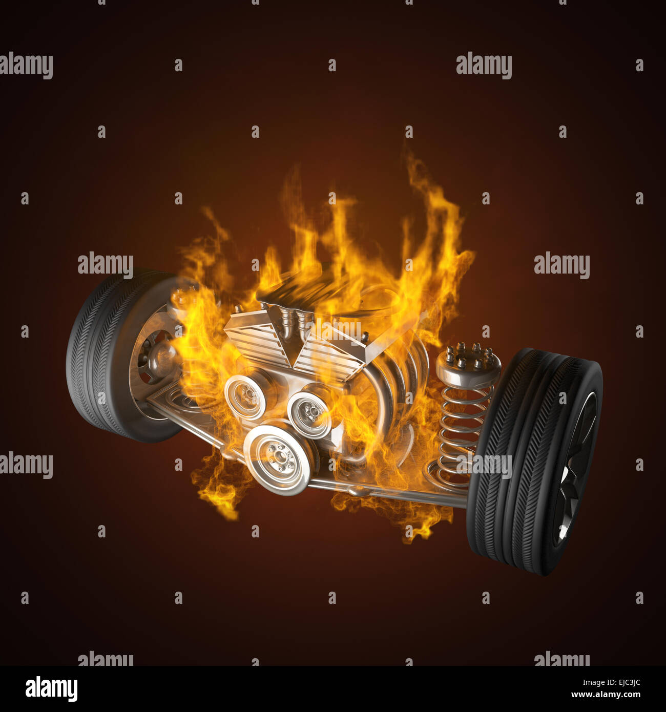 burning car chassis with engine and wheels Stock Photo