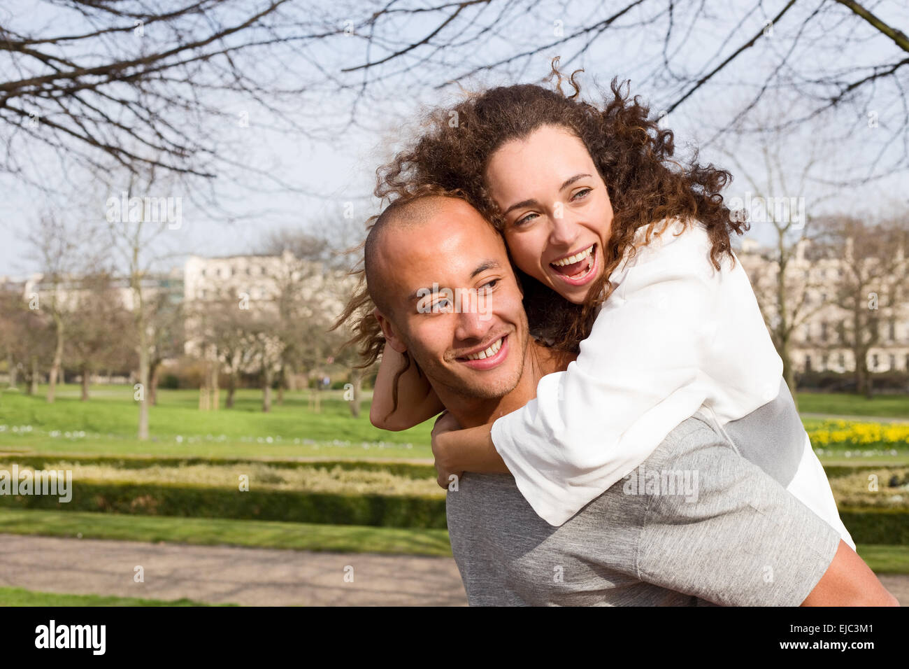 young couple having fun in the park Stock Photo