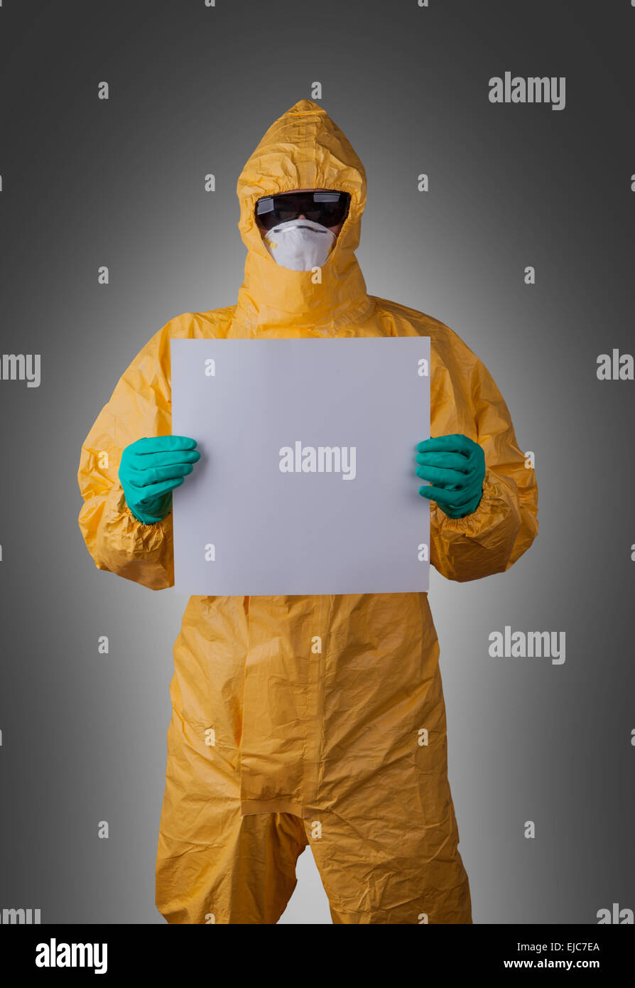 Scientist with protective yellow hazmat suit, ebola concept. Stock Photo