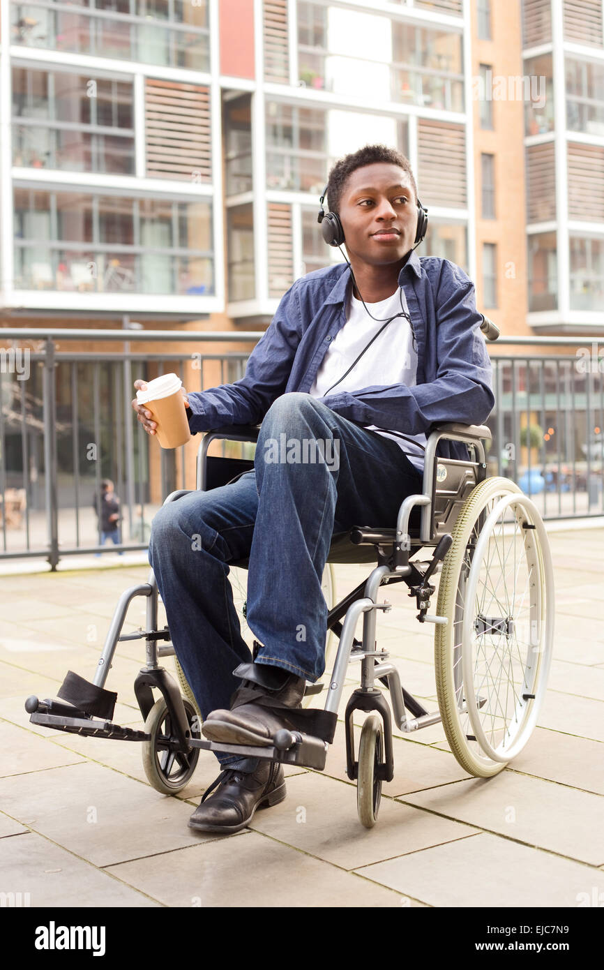 young wheelchair user relaxing with coffee Stock Photo Alamy