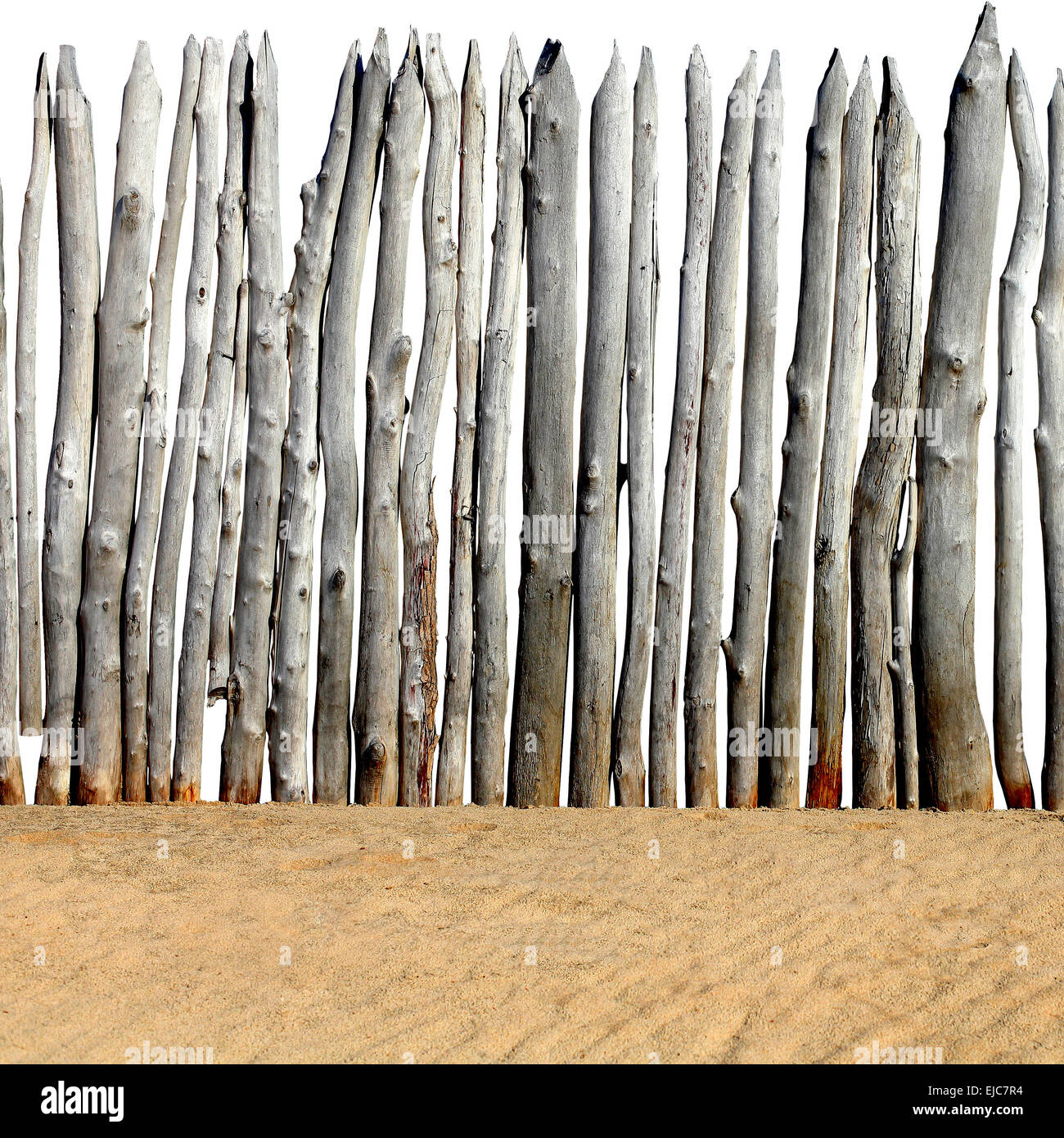 Wooden Fence on the Sand Stock Photo