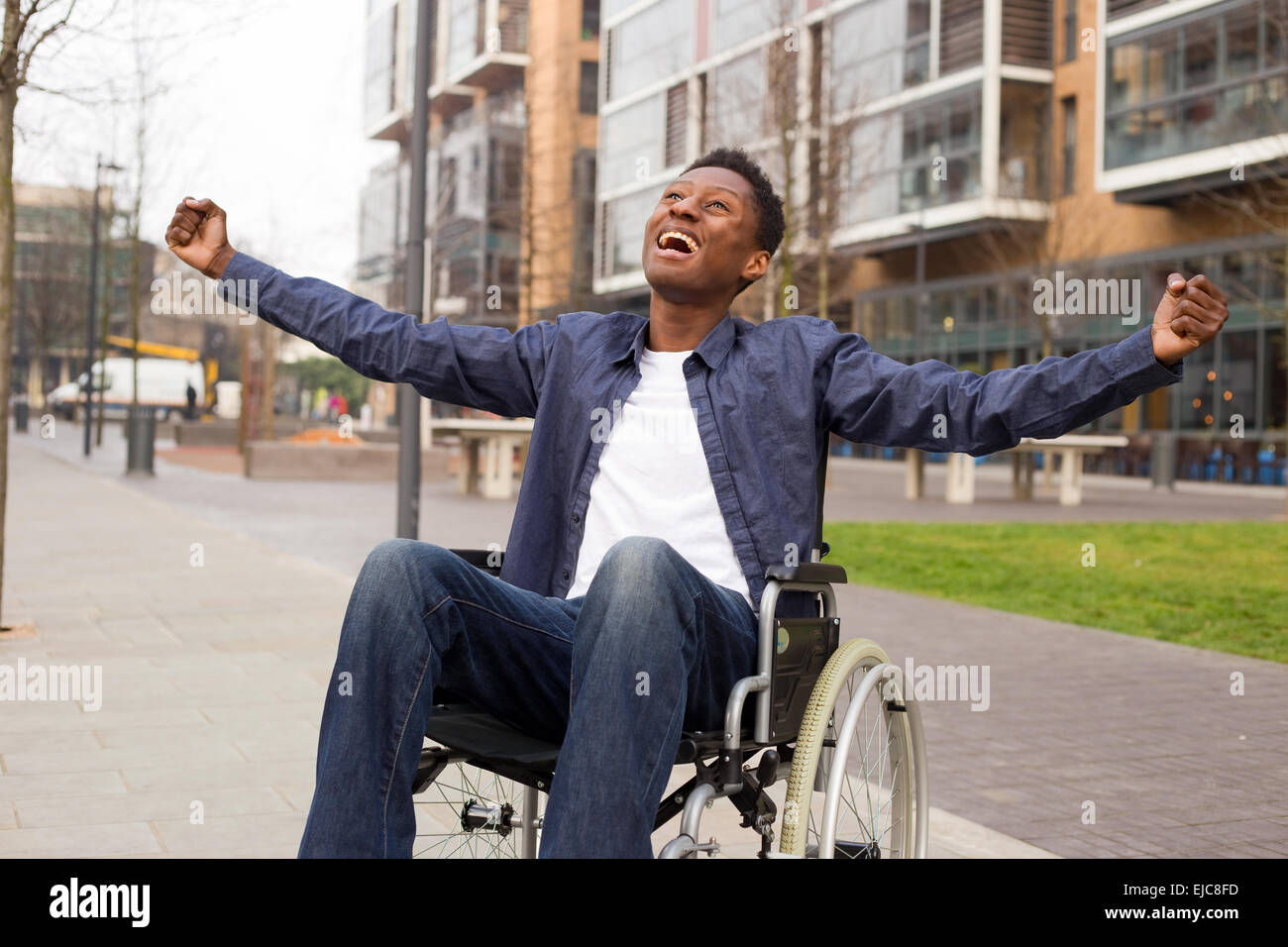 a young wheelchair user celebrating Stock Photo Alamy
