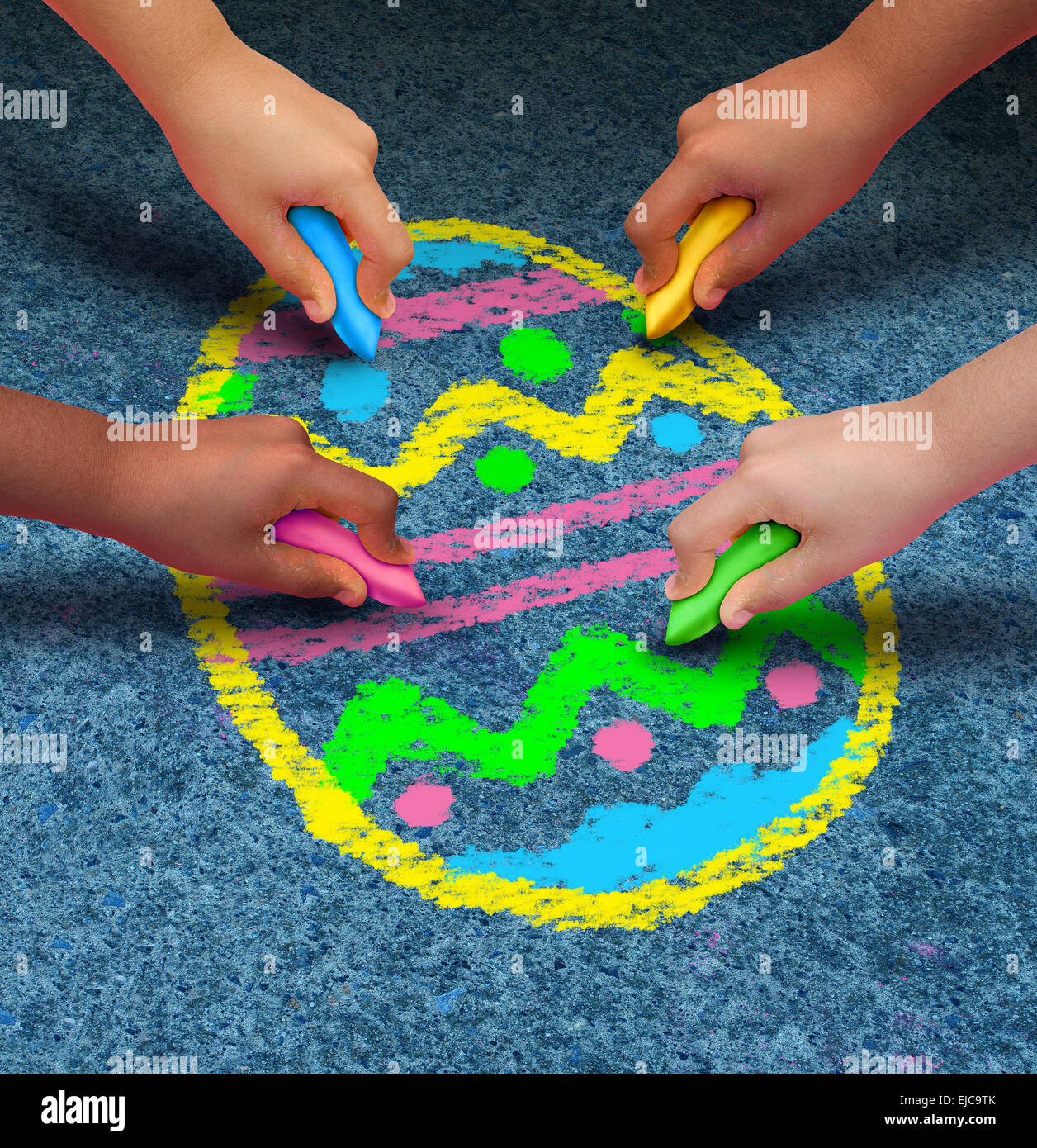 Easter arts and crafts concept as a group of children with chalk drawing a decorated egg on an asphalt texture as a symbol for cooperation and fun seasonal activities for kids. Stock Photo