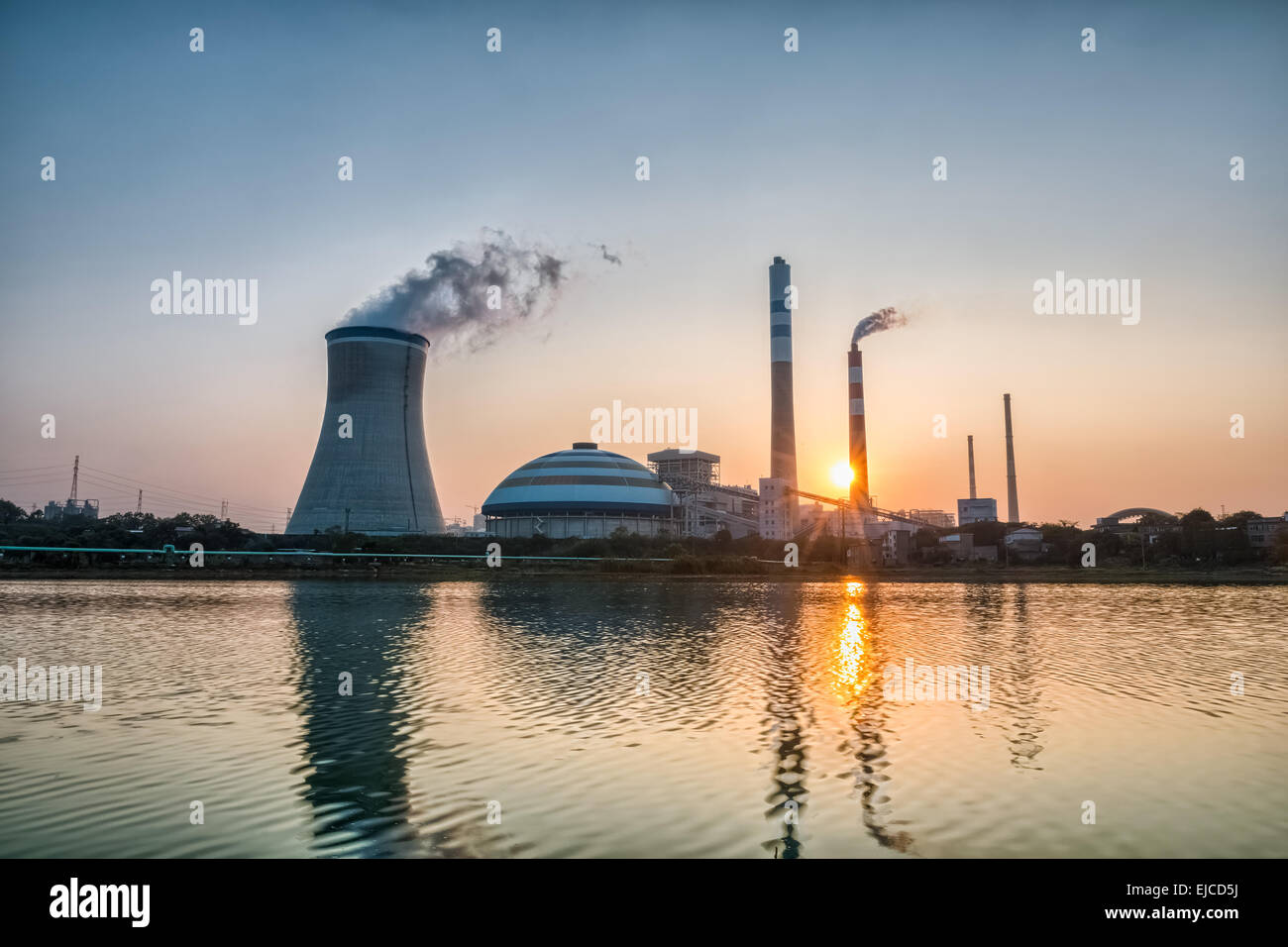 power plant with the setting sun Stock Photo