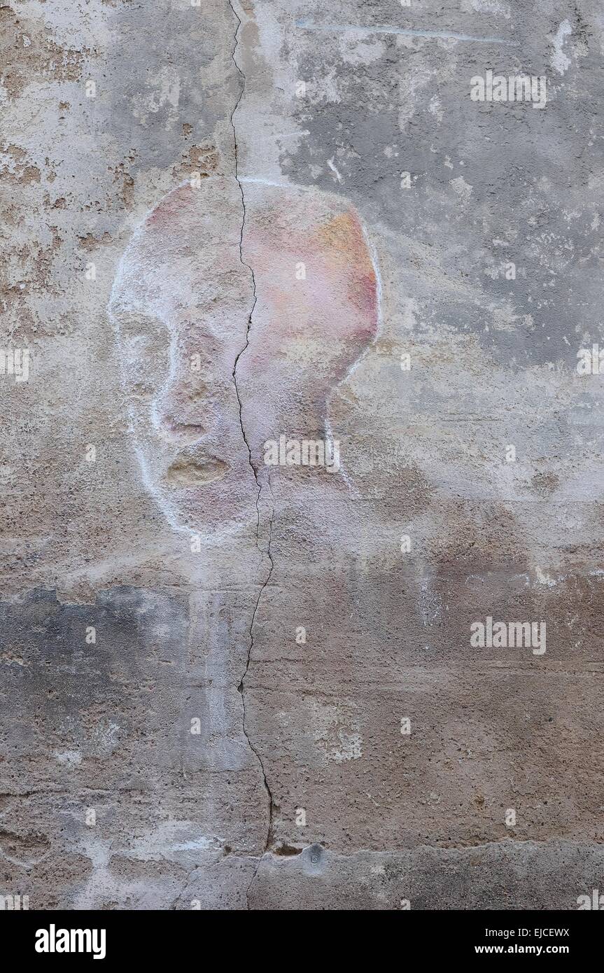 Face on the wall Stock Photo