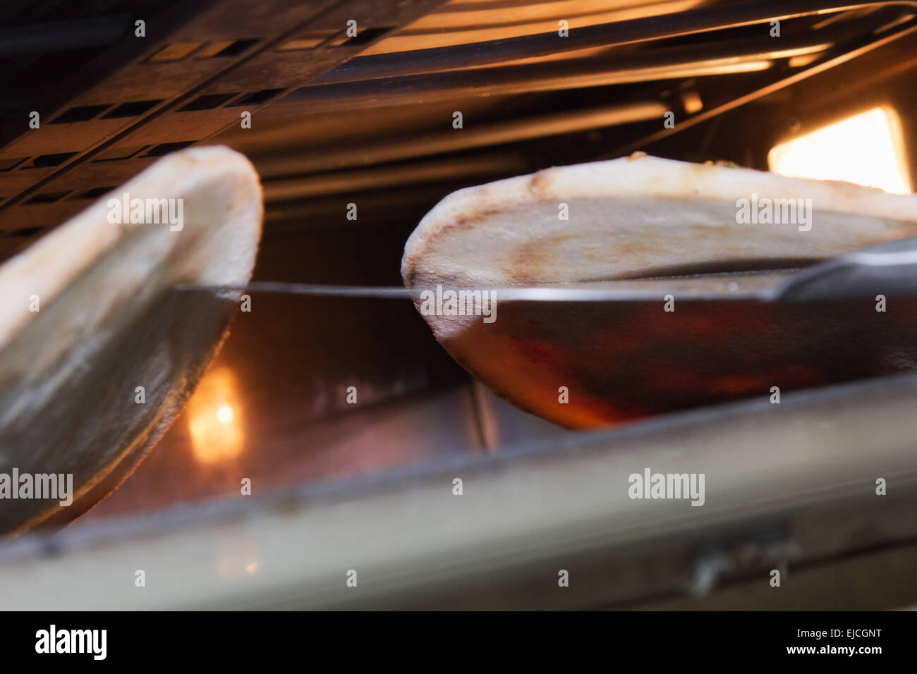 base for pizza in the oven Stock Photo Alamy