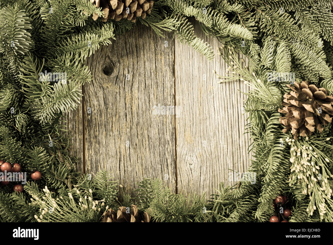Christmas Wreath with Rustic Wood Background Stock Photo - Alamy