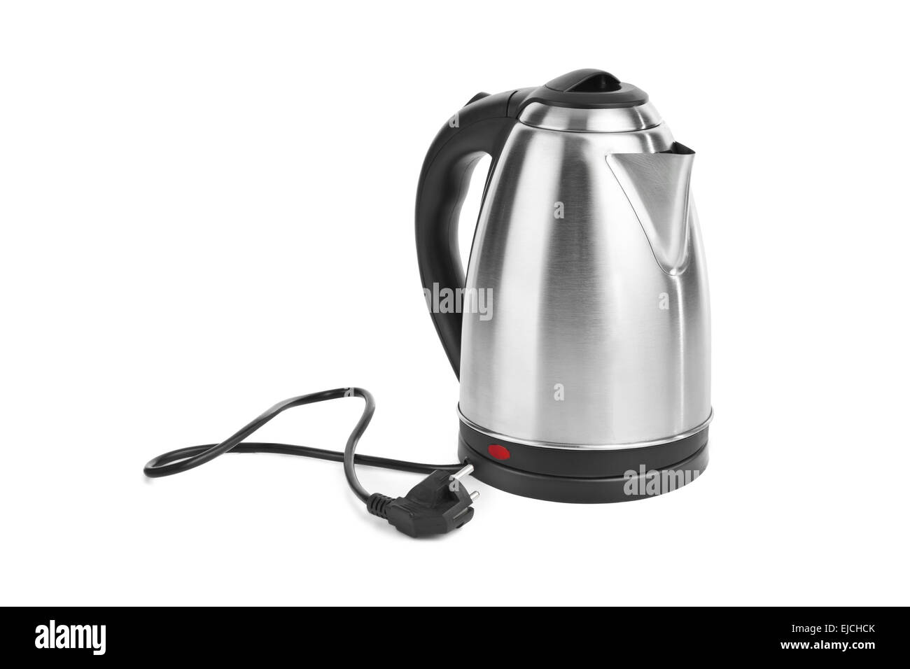 White electric kettle stands on a gray table plugged into a power outlet  Stock Photo - Alamy