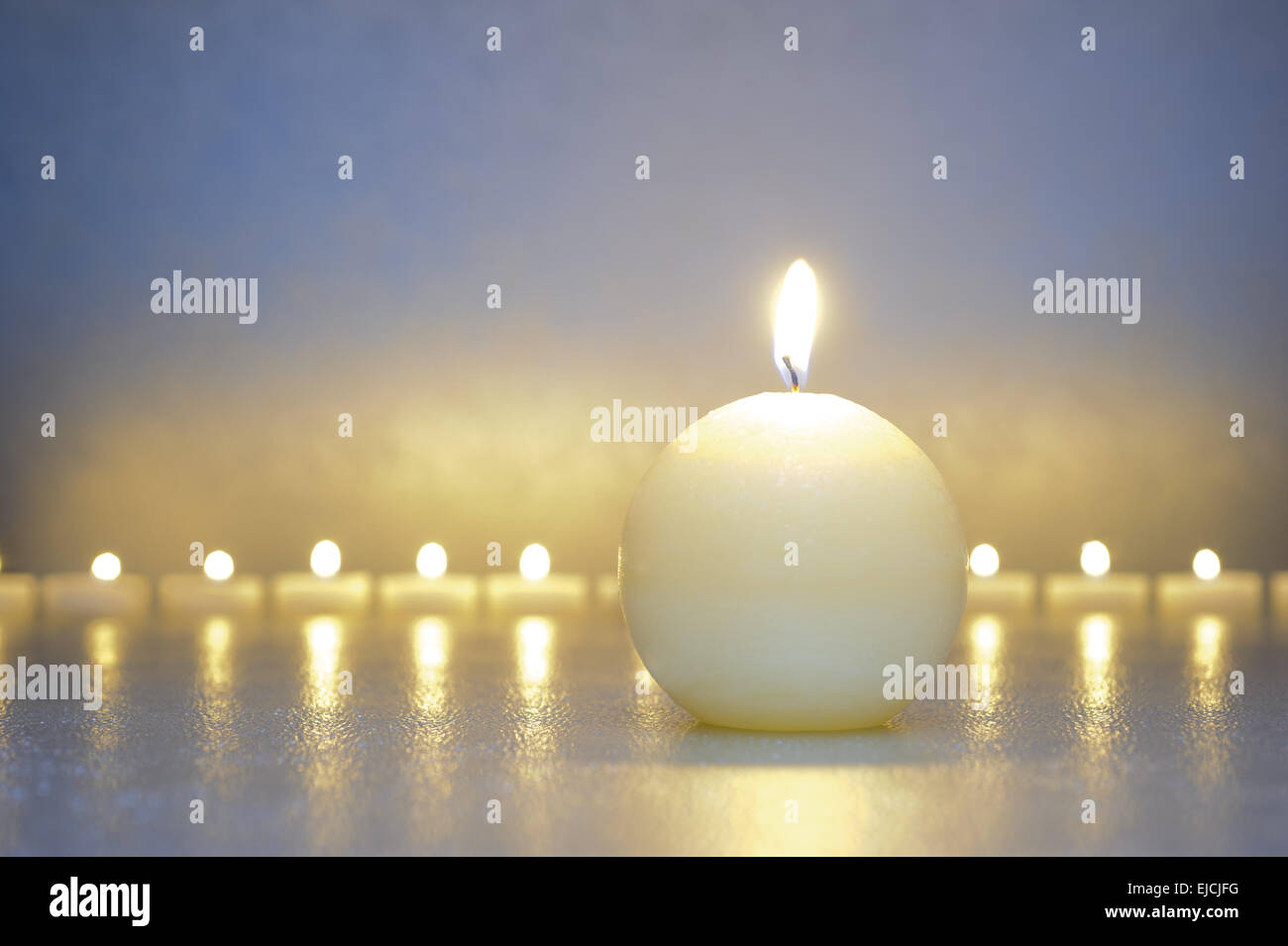 zen garden with candle lights in row Stock Photo