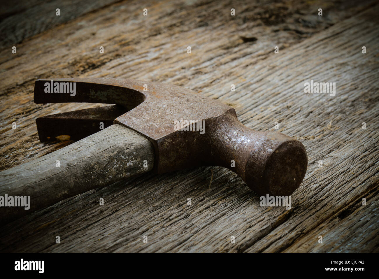 hammer on rustic hardwood floor Stock Photo Alamy