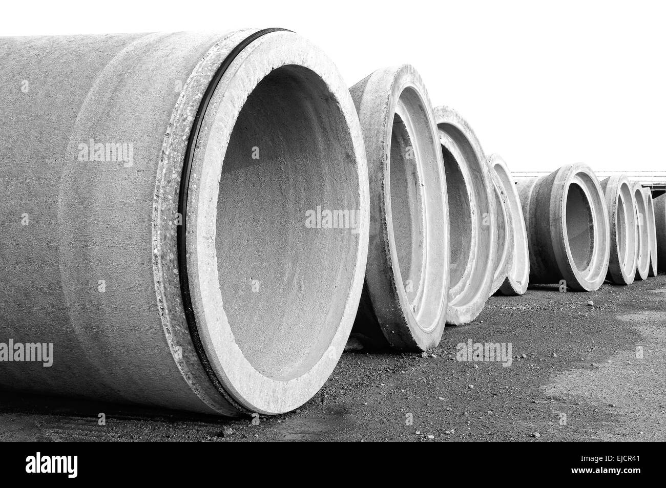 Spun concrete pipes directed on the edge Stock Photo